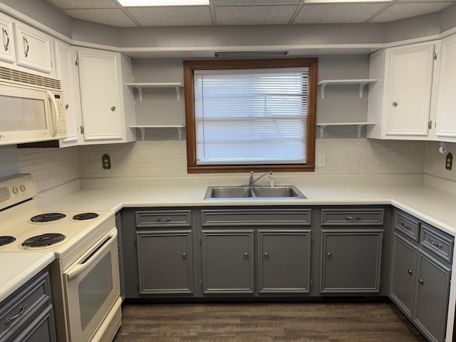 kitchen featuring gray cabinets, open shelves, a sink, white cabinetry, and white appliances