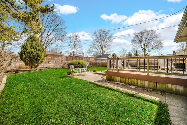 view of yard with a deck and a patio area