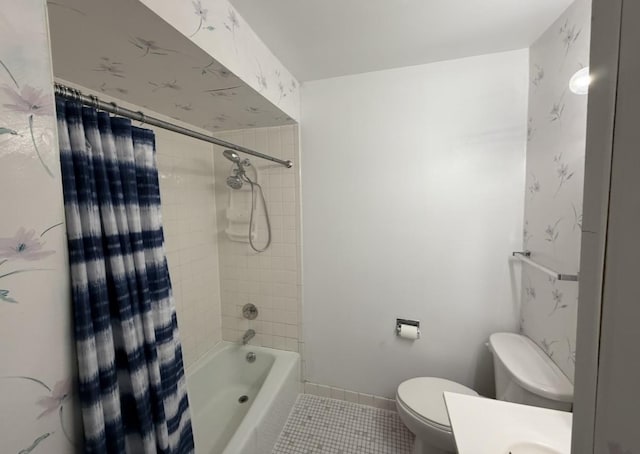 full bath with toilet, shower / tub combo, tile patterned flooring, baseboards, and vanity