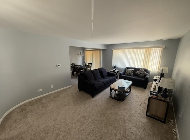 living room with baseboards and carpet