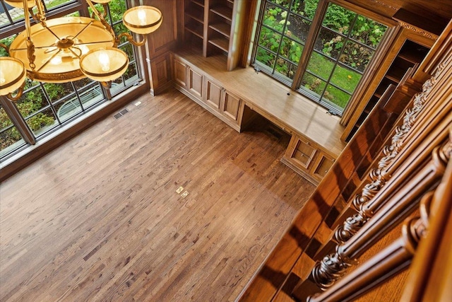 interior space featuring wood finished floors and visible vents