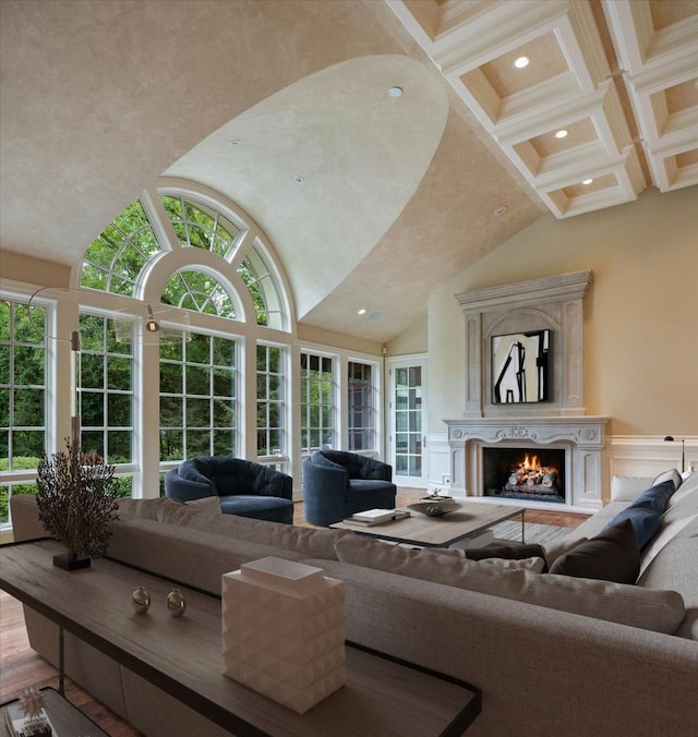 living room featuring a wealth of natural light, high vaulted ceiling, and recessed lighting