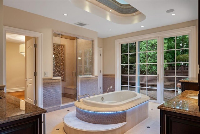 full bath with visible vents, a garden tub, recessed lighting, a shower stall, and vanity