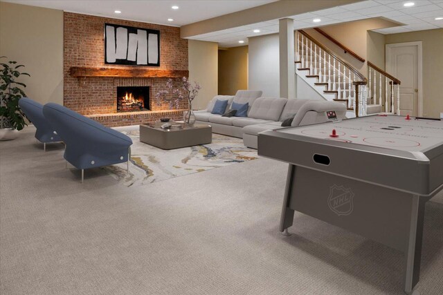 game room featuring recessed lighting, a fireplace, carpet floors, and a paneled ceiling