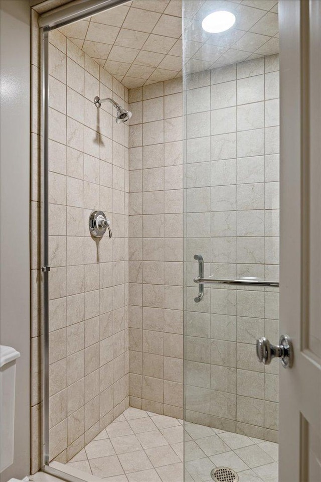 bathroom featuring a shower stall