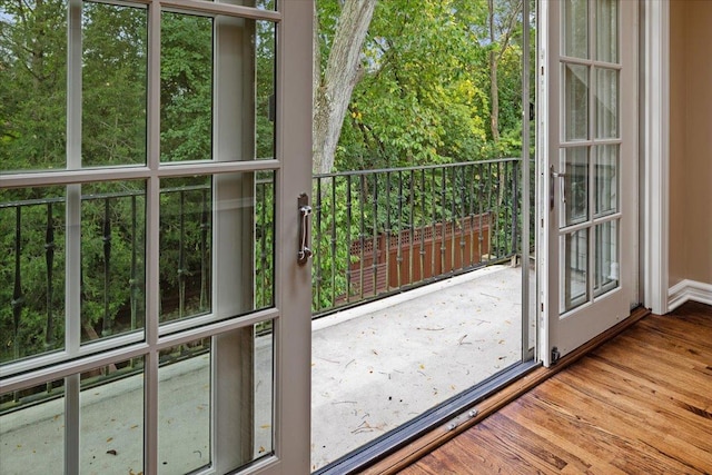 doorway to outside featuring wood finished floors