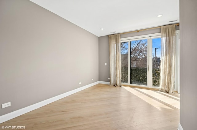 unfurnished room featuring recessed lighting, visible vents, baseboards, and light wood-style flooring