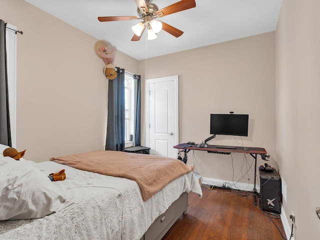 bedroom featuring a ceiling fan and wood finished floors