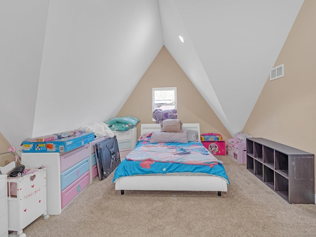 bedroom with lofted ceiling, visible vents, and carpet floors