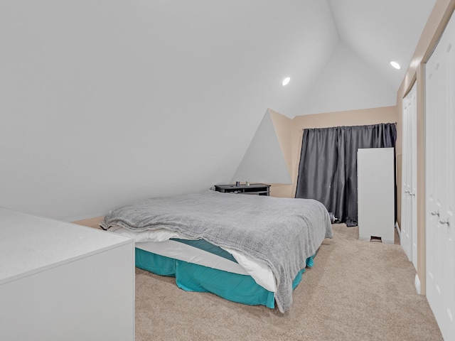 bedroom with recessed lighting, light colored carpet, and vaulted ceiling