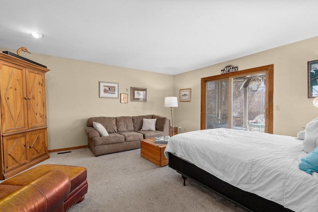 bedroom with baseboards, light carpet, visible vents, and access to exterior