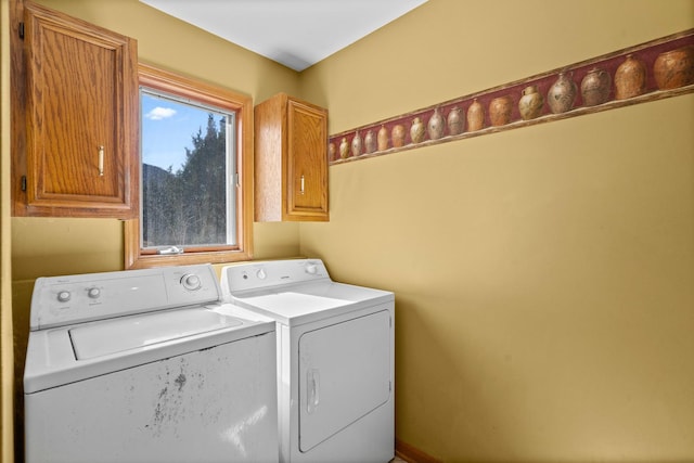 laundry area featuring cabinet space and independent washer and dryer