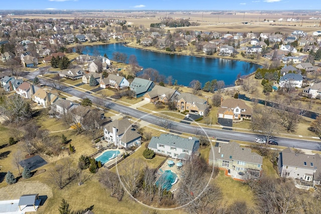 bird's eye view featuring a residential view and a water view