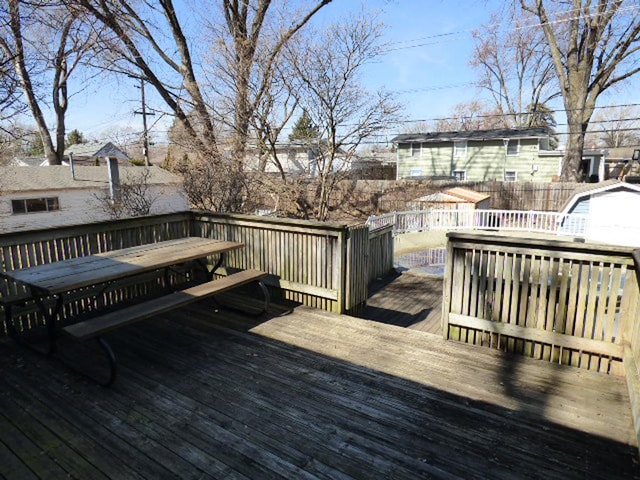 wooden deck featuring fence