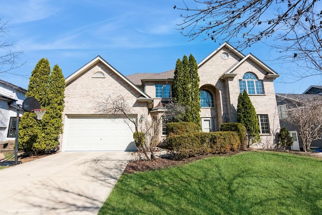 traditional home featuring brick siding, driveway, an attached garage, and a front lawn