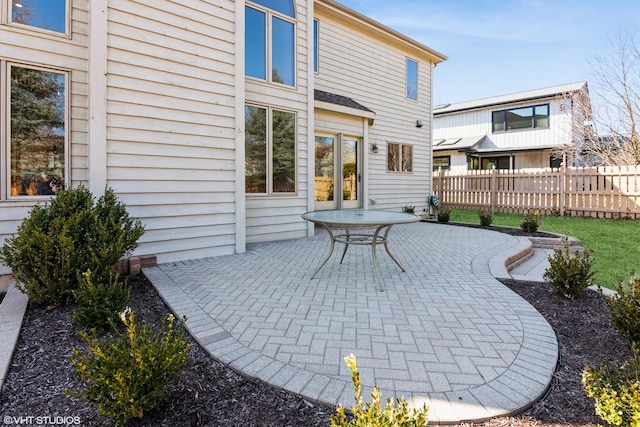 view of patio featuring fence