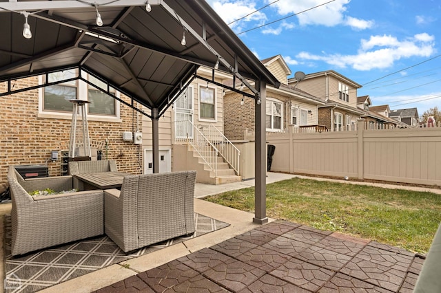 view of patio with a residential view and fence