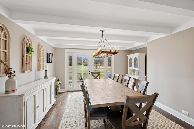 dining room with dark wood-type flooring, french doors, baseboards, and a notable chandelier