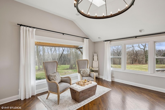 sitting room with baseboards, vaulted ceiling, a chandelier, visible vents, and dark wood finished floors
