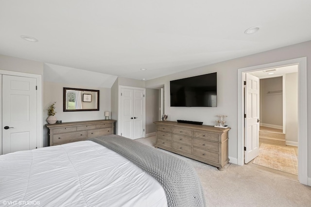 bedroom featuring baseboards, recessed lighting, and light colored carpet