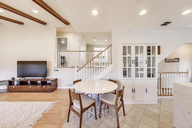 dining room with recessed lighting, beamed ceiling, visible vents, and stairs