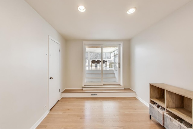 unfurnished dining area featuring visible vents, recessed lighting, baseboards, and light wood-style floors