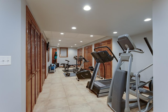 workout room with recessed lighting and a drop ceiling