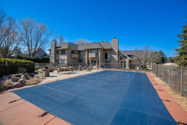 view of pool with a patio, fence, and a fenced in pool