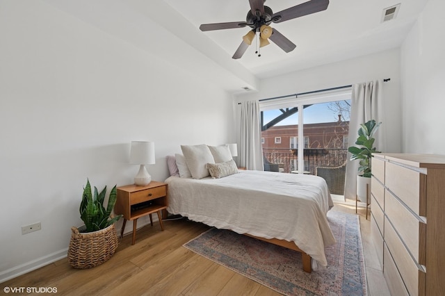 bedroom featuring visible vents, light wood-style flooring, a ceiling fan, access to outside, and baseboards