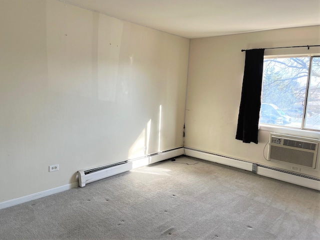 carpeted empty room featuring an AC wall unit and baseboards