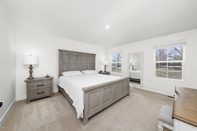 bedroom with recessed lighting, light colored carpet, and baseboards