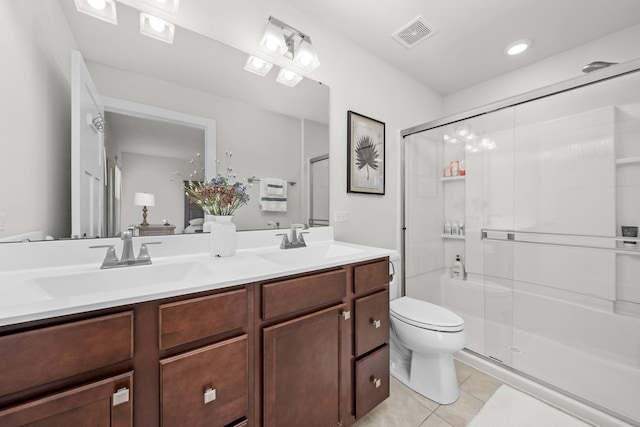 full bathroom with tile patterned floors, visible vents, toilet, and a sink