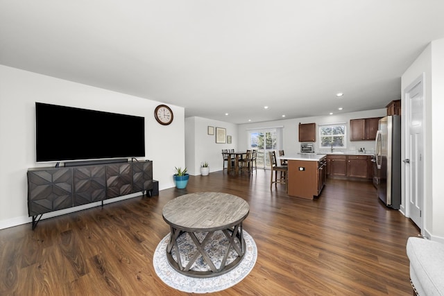 living room featuring recessed lighting and dark wood-type flooring