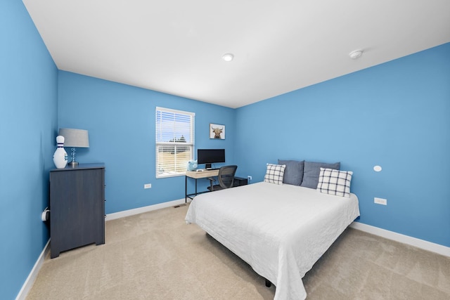 bedroom featuring baseboards and carpet floors