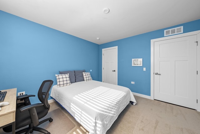 bedroom with visible vents, carpet floors, and baseboards