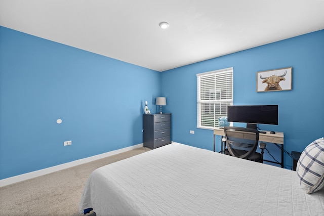 bedroom with carpet flooring and baseboards