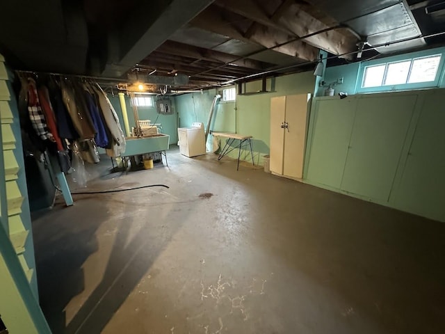 below grade area featuring washer / dryer and a sink