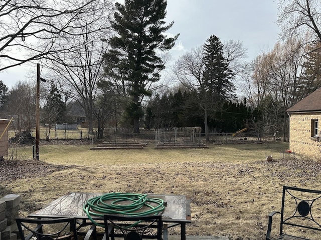 view of yard featuring a garden and fence