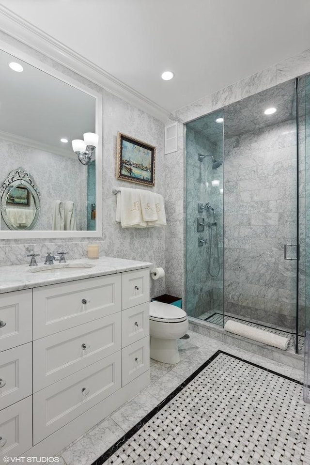 full bathroom featuring toilet, ornamental molding, recessed lighting, a stall shower, and vanity