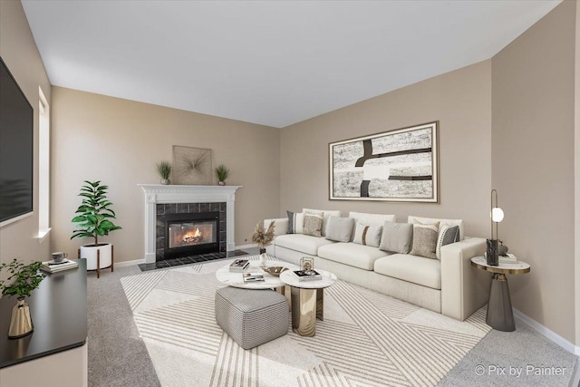 living area featuring baseboards, carpet floors, and a tiled fireplace