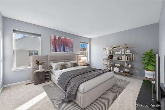 bedroom featuring visible vents, baseboards, and carpet