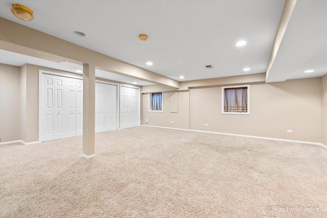 finished basement with carpet flooring, recessed lighting, and baseboards