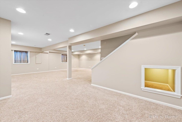 finished basement featuring recessed lighting, baseboards, visible vents, and carpet floors