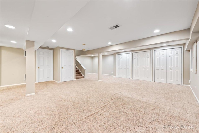 finished below grade area with recessed lighting, visible vents, baseboards, and carpet flooring