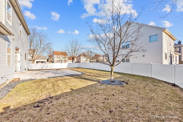 view of yard with a patio area and a fenced backyard