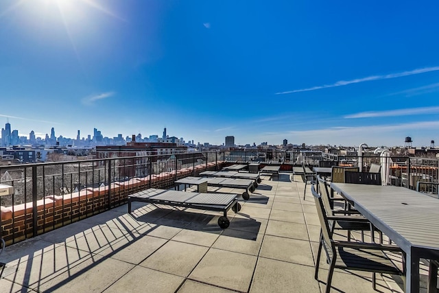 view of patio / terrace featuring a city view