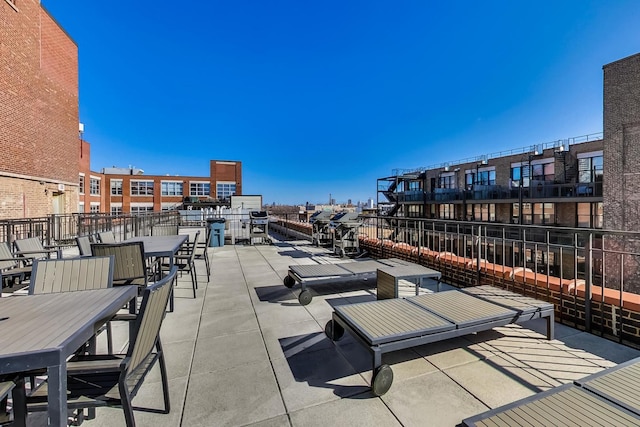 view of patio featuring outdoor dining area