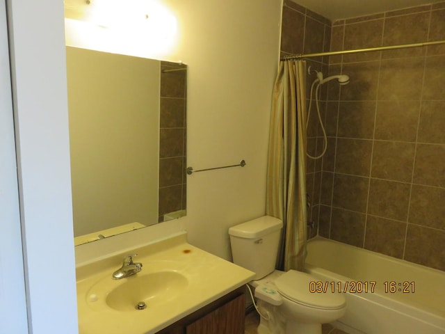 full bathroom with vanity, toilet, and shower / bath combo