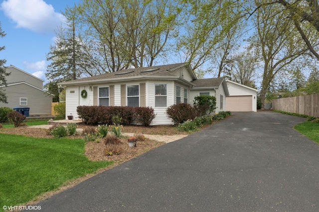 single story home with a detached garage