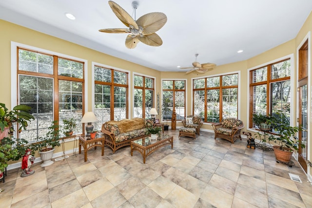 sunroom with visible vents and ceiling fan